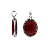 Sterling silver oval pendant with red coral and twisted rope silver frame handcrafted in Bali